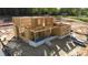 New home's framing displays the open layout, covered porches, and quality brick lined foundation at 4251 Candlewood Dr, Sherrills Ford, NC 28673
