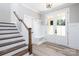 Charming entryway with staircase, board and batten accents, and a convenient bench at 4251 Candlewood Dr, Sherrills Ford, NC 28673