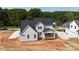 Aerial view of a two-story new construction home with covered porch at 4251 Candlewood Dr, Sherrills Ford, NC 28673