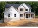 Charming two-story home with brick, light-colored siding, and a covered front porch at 4251 Candlewood Dr, Sherrills Ford, NC 28673