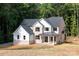 Beautiful two-story home with dark roof, white siding, and brick exterior at 4251 Candlewood Dr, Sherrills Ford, NC 28673