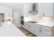 Modern kitchen featuring white cabinets, stainless steel appliances, and a sleek design at 4251 Candlewood Dr, Sherrills Ford, NC 28673