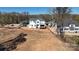 An aerial view of a white two story house with a dark roof under construction and surrounding land at 4257 Candlewood Dr # 7, Sherrills Ford, NC 28673