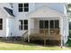 Covered wooden back porch with outdoor seating area in a newly constructed two-story home at 4257 Candlewood Dr # 7, Sherrills Ford, NC 28673