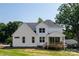 Exterior view of a white two-story home, showcasing a backyard wooden deck and lush lawn at 4257 Candlewood Dr # 7, Sherrills Ford, NC 28673
