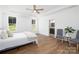 Light-filled bedroom with hardwood floors, two windows, a ceiling fan, and neutral paint at 4257 Candlewood Dr # 7, Sherrills Ford, NC 28673