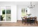 Bright dining area with wood table, seating for six, and a sliding glass door to the outside deck at 4257 Candlewood Dr # 7, Sherrills Ford, NC 28673