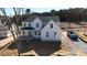 New construction with a light blue front door and white siding, awaiting final touches in a wooded neighborhood at 4257 Candlewood Dr # 7, Sherrills Ford, NC 28673