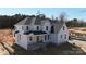 Exterior view of a new two story home featuring a covered front porch and white board and batten siding at 4257 Candlewood Dr # 7, Sherrills Ford, NC 28673