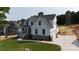 Charming two-story home with white siding, stone accents, an attached garage, and landscaped lawn at 4257 Candlewood Dr # 7, Sherrills Ford, NC 28673