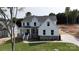 Beautiful two-story home featuring white siding, stone accents, gabled roof, and a well-manicured lawn at 4257 Candlewood Dr # 7, Sherrills Ford, NC 28673