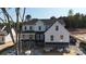 A side view of a white two story house with a dark roof and stone accents under construction at 4257 Candlewood Dr # 7, Sherrills Ford, NC 28673
