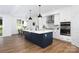 Open-concept kitchen featuring a center island with a sink, white cabinets, and modern appliances at 4257 Candlewood Dr # 7, Sherrills Ford, NC 28673