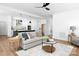 Open concept living room with view of kitchen island, tile backsplash, stainless appliances, and modern lighting at 4257 Candlewood Dr # 7, Sherrills Ford, NC 28673