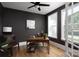 Dark painted home office with an industrial desk, leather chairs, a ceiling fan, and natural light at 4257 Candlewood Dr # 7, Sherrills Ford, NC 28673