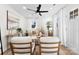 Cozy living room with light walls, neutral furniture, and ceiling fan at 507 W Henry St, Belmont, NC 28012