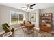 Bright home office features built-in shelving and hardwood floors at 5410 Seacroft Rd, Charlotte, NC 28210