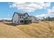 Expansive new backyard and home exterior featuring a screened in porch and modern gray exterior at 604 Hyder Trl, Tega Cay, SC 29708