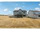 New construction featuring a spacious backyard with a screened in porch and modern gray exterior at 604 Hyder Trl, Tega Cay, SC 29708