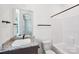 Clean bathroom featuring a granite countertop, modern fixtures, and a shower and tub combo at 604 Hyder Trl, Tega Cay, SC 29708