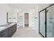 Modern bathroom with double sinks, a glass shower, and plenty of storage at 604 Hyder Trl, Tega Cay, SC 29708