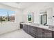 Bright bathroom features a granite countertop, dual sinks, and large windows at 604 Hyder Trl, Tega Cay, SC 29708