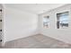 Bright bedroom featuring neutral walls, carpet, and large windows for natural light at 604 Hyder Trl, Tega Cay, SC 29708