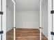 Empty bedroom featuring neutral walls, hardwood floors, and an ensuite bathroom at 604 Hyder Trl, Tega Cay, SC 29708
