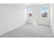 Well-lit bedroom with plush carpeting and two windows allowing ample natural light at 604 Hyder Trl, Tega Cay, SC 29708