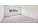 Bright bedroom with a large window and neutral carpet at 604 Hyder Trl, Tega Cay, SC 29708