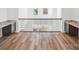 Open hallway with a built-in desk and hardwood floors at 604 Hyder Trl, Tega Cay, SC 29708
