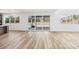 Bright living room featuring a sliding glass door leading to the backyard and patio at 604 Hyder Trl, Tega Cay, SC 29708