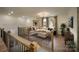 Inviting loft area with staircase, comfortable seating and large tv creates a cozy retreat at 604 Hyder Trl, Tega Cay, SC 29708