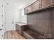Well-organized mudroom with custom built-ins, granite counters, seating and plentiful storage at 604 Hyder Trl, Tega Cay, SC 29708