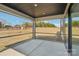 Covered screened in porch overlooking a sprawling backyard, ideal for relaxation at 604 Hyder Trl, Tega Cay, SC 29708