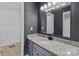 Bathroom with granite countertop, blue vanity, and linen closet at 700 Leonard Ave, Kannapolis, NC 28081