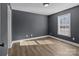 Spacious bedroom with light brown wood flooring and gray walls at 700 Leonard Ave, Kannapolis, NC 28081