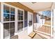 Inviting front porch with white railing and welcome mat at 700 Leonard Ave, Kannapolis, NC 28081