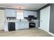 Updated kitchen featuring light gray cabinets, stainless steel appliances, and granite countertops at 700 Leonard Ave, Kannapolis, NC 28081