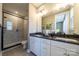 Modern bathroom featuring double vanity, walk-in shower, and sleek fixtures at 8018 Elevate Ct, Charlotte, NC 28205