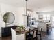 Elegant dining room with a large wooden table and chandelier at 8018 Elevate Ct, Charlotte, NC 28205