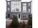 Modern townhouses with gray and white exterior at 8018 Elevate Ct, Charlotte, NC 28205