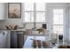 Modern kitchen with stainless steel appliances and a large island at 8018 Elevate Ct, Charlotte, NC 28205