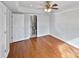 Hardwood floor bedroom with private bathroom access at 8035 Bristle Ln, Charlotte, NC 28214
