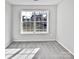 Well-lit bedroom with gray carpet and large window at 8035 Bristle Ln, Charlotte, NC 28214