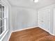 Simple bedroom with hardwood floors and double door closet at 8035 Bristle Ln, Charlotte, NC 28214