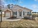 Brick and siding ranch home with attached garage and landscaped yard at 8035 Bristle Ln, Charlotte, NC 28214