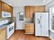 Kitchen with wood cabinets, granite countertops, and stainless steel appliances at 8035 Bristle Ln, Charlotte, NC 28214