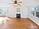 Living room with hardwood floors, fireplace and large windows at 8035 Bristle Ln, Charlotte, NC 28214
