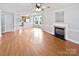 Bright living room featuring hardwood floors and a fireplace at 8035 Bristle Ln, Charlotte, NC 28214
